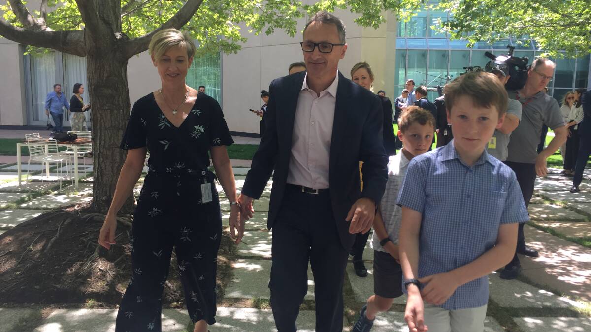 Richard Di Natale with wife Lucy Quarterman and sons Luca, 11, and Ben, 9, after announcing his departure from politics on Monday. Picture: Kirsten Lawson