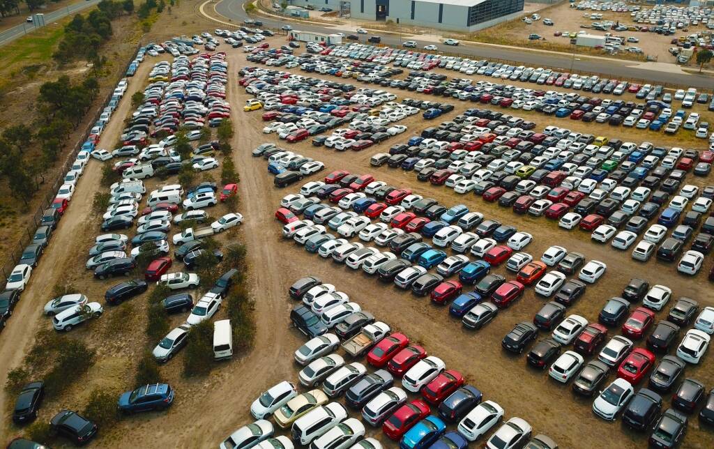 The sea of hail-damaged cars sitting in Hume last year. Picture: Sittihaxay Ditthavong