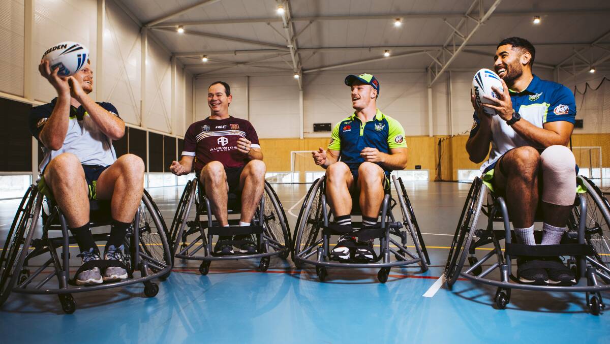 Former Queensland wheelchair rugby league player Matt Collins, second from left, put Raiders Corey Horsburgh, Tom Starling and Andre Niko through their paces. Picture: Jamila Toderas