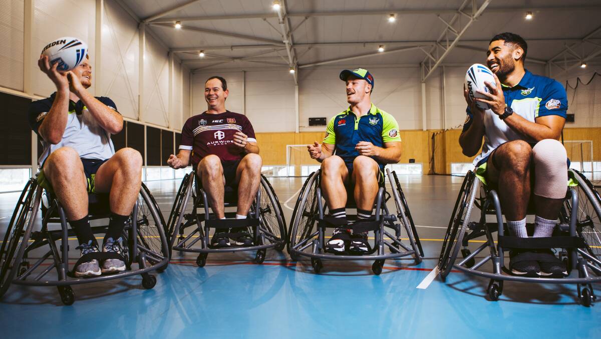 Wheelchair rugby league player Matt Collins with Raiders Corey Horsburgh, Tom Starling, and Andre Niko. Picture: Jamila Toderas