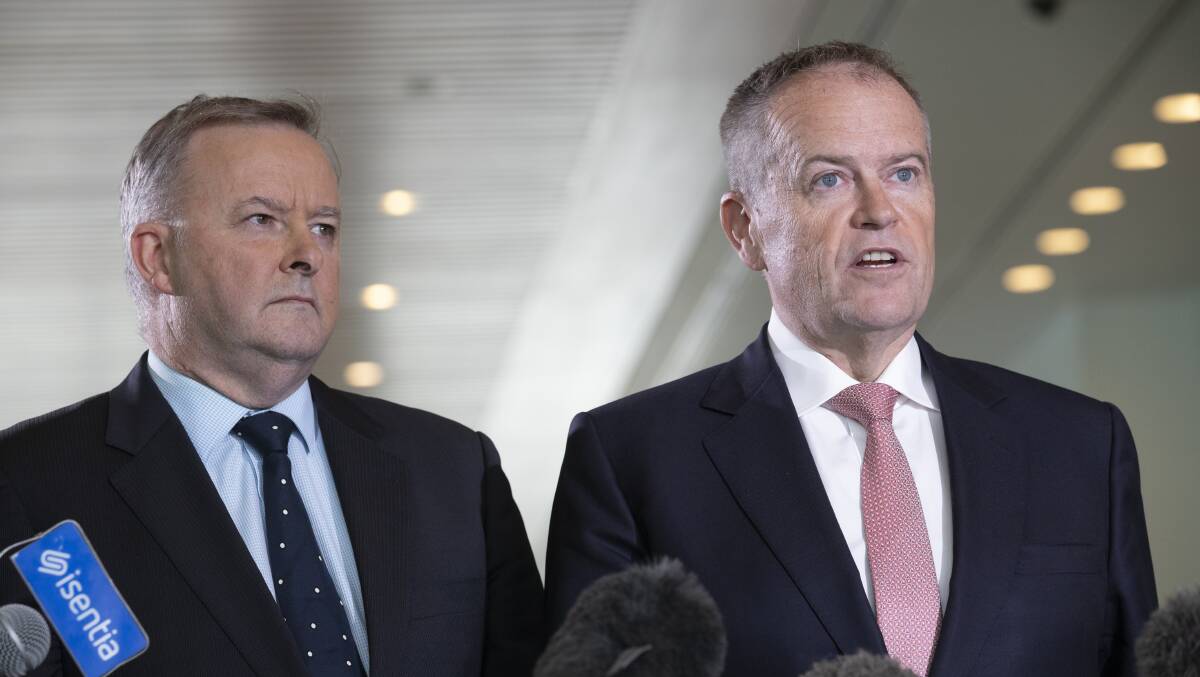 Former labor leader Bill Shorten, right, favoured by China to win, but no evidence that a Chinese propaganda campaign was waged on his behalf. Picture: Sitthixay Ditthavong