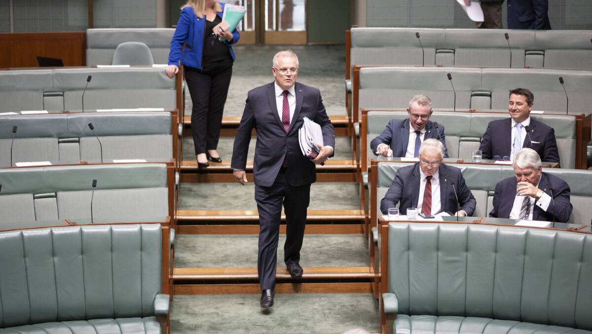 Prime Minister Scott Morrison enters the House of Representatives. Picture: Sitthixay Ditthavong