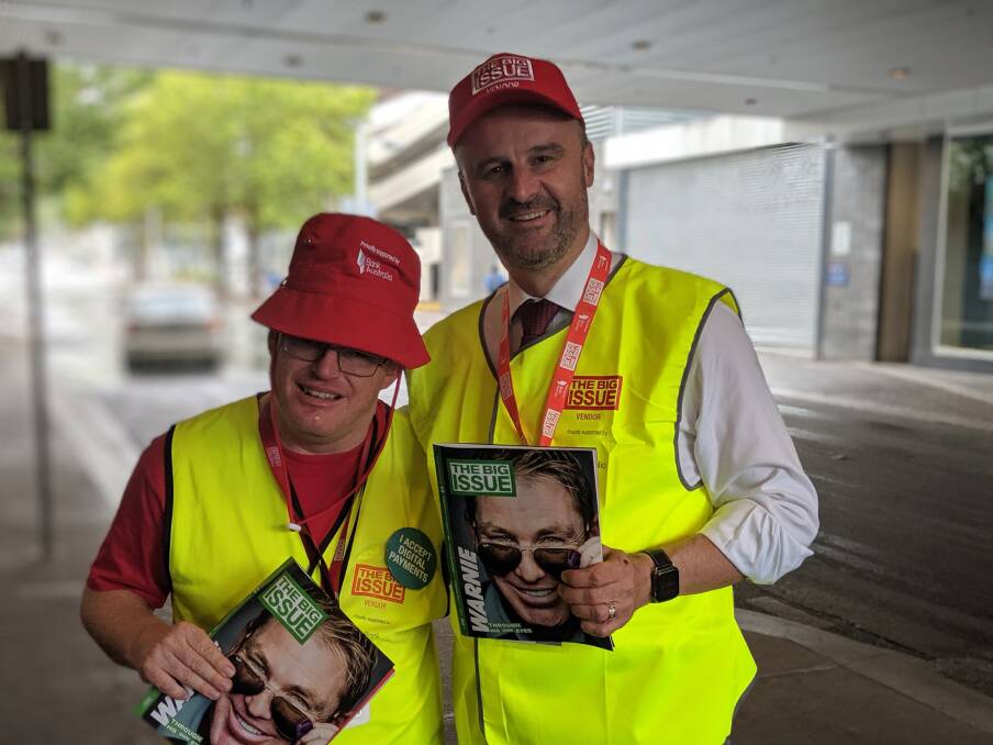 Bryan selling The Big Issue in Civic with Chief Minister Andrew Barr.