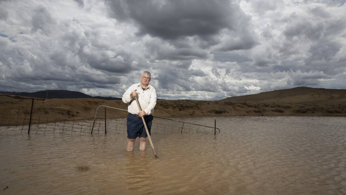 Tom Allen stands in one of his dams in February which went from bone dry to full with two days' rain. Picture: Sitthixay Ditthavong