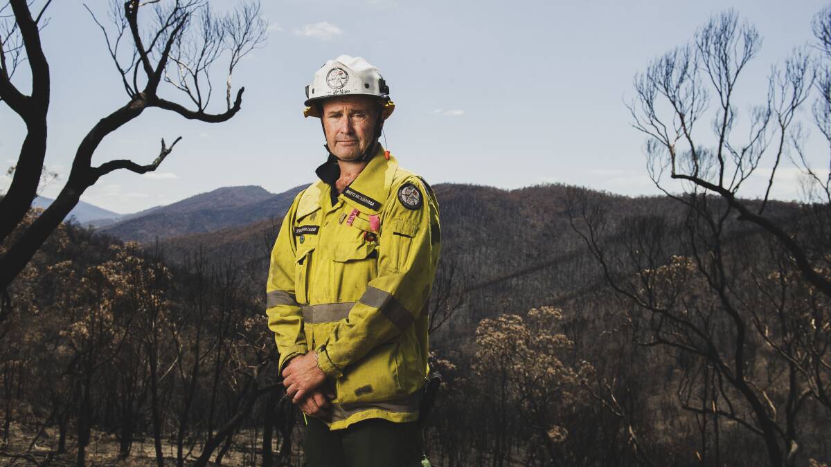 Namadgi National Park manager Brett McNamara surrounded by burnt land from the Orroral fire at Namadgi National Park. Picture: Dion Georgopoulos.