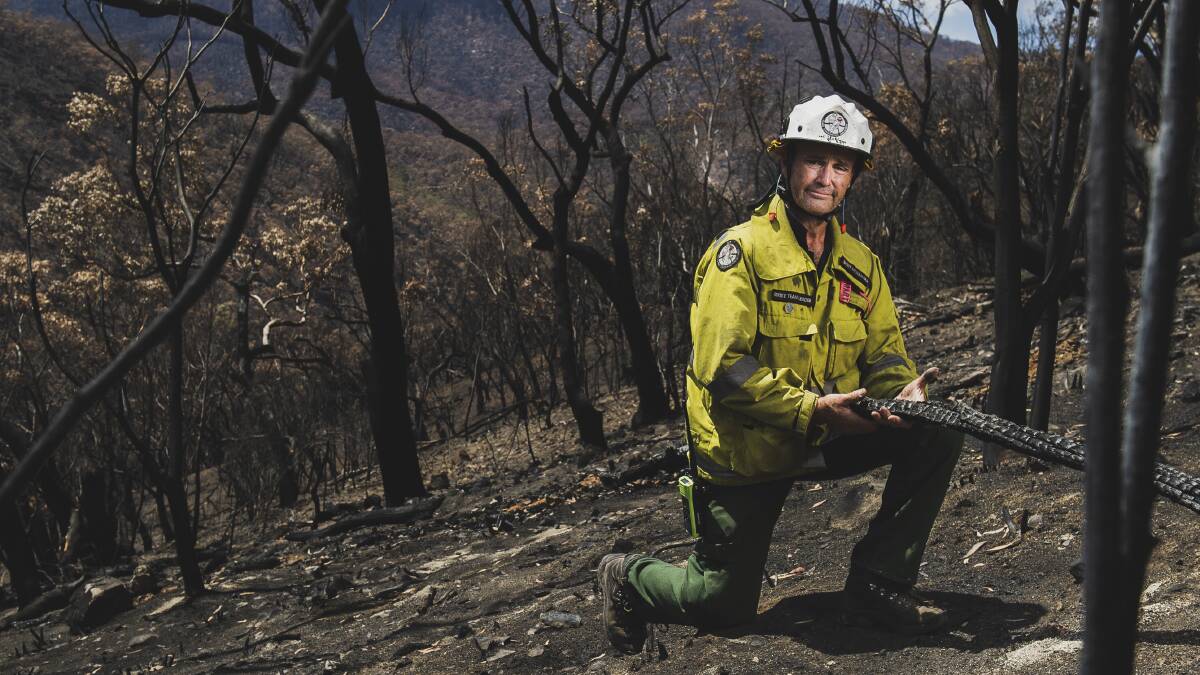 Namadgi National Park manager Brett McNamara surrounded by burnt land from the Orroral fire at Namadgi National Park. Picture: Dion Georgopoulos.