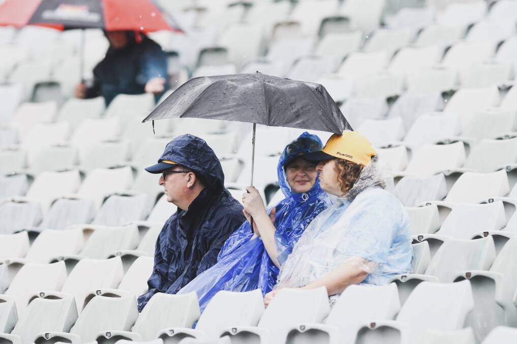 Crowds rug up against the rain at the Brumbies v RugbyWA game at GIO Stadium on Saturday. Picture: Dion Georgopoulos