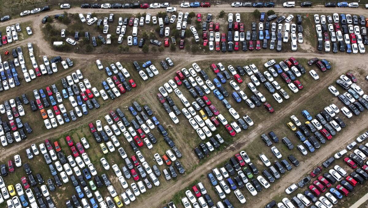 Some of the 30,000 cars damaged during January's hailstorm are parked in Hume waiting to be auctioned. Picture: Sitthixay Ditthavong