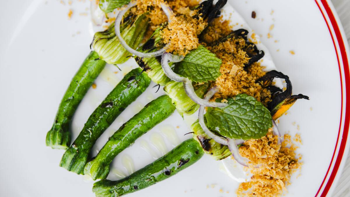Zucchini flowers, shallot, mint, labneh, and pangrattato. Picture: Jamila Toderas 