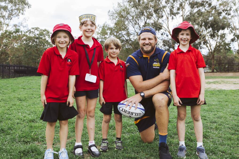 Brumbies' James Slipper with students, from left, Felicity Hearne, 7, Isabelle Witika, 7, Henry Dowling, 6, and Maddie Mitchell, 7. Picture: Jamila Toderas