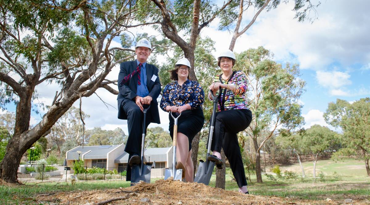 John James Foundation chair Professor Paul Smith, Minister for Disability Suzanne Orr and AEIOU Foundation chair Susan Rix turn the first sod of the new AEIOU autism hub in Canberra on Wednesday. Picture: Elesa Kurtz 