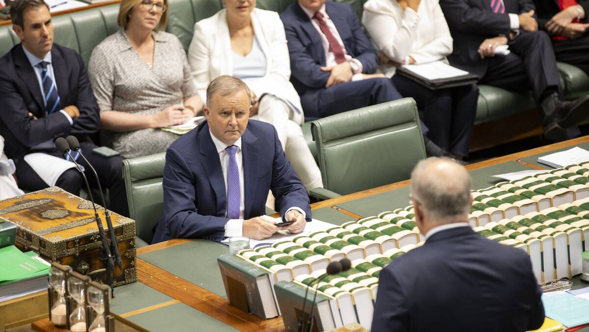 Opposition Leader Anthony Albanese sits across from Prime Minister Scott Morrison. Picture: Sitthixay Ditthavong
