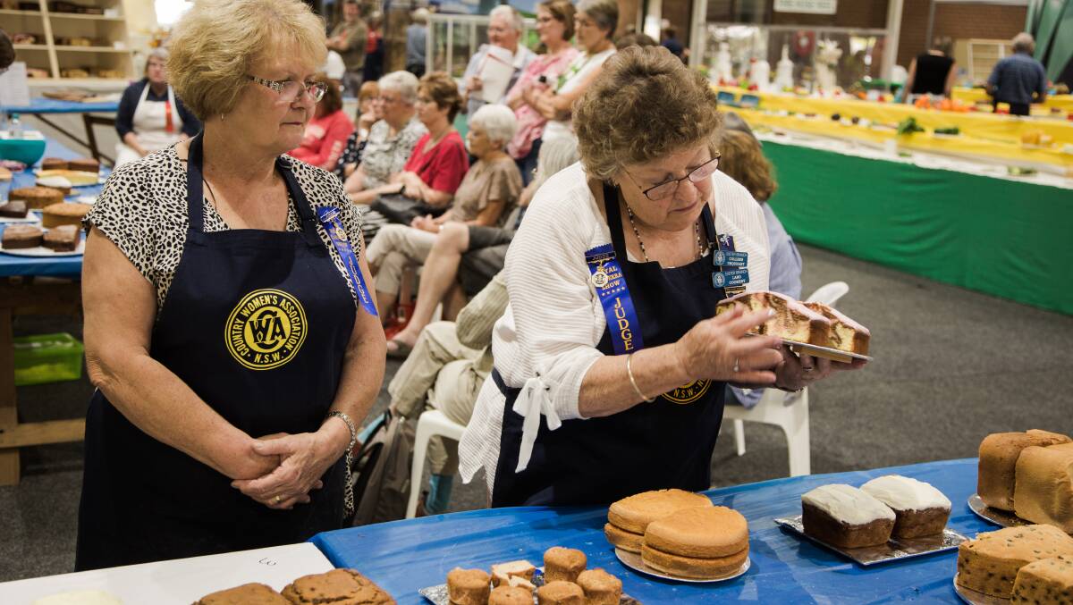 Judges Pat Mulley and Colleen Urquhart look over the table of champions. Picture: Ashraf Alreshan