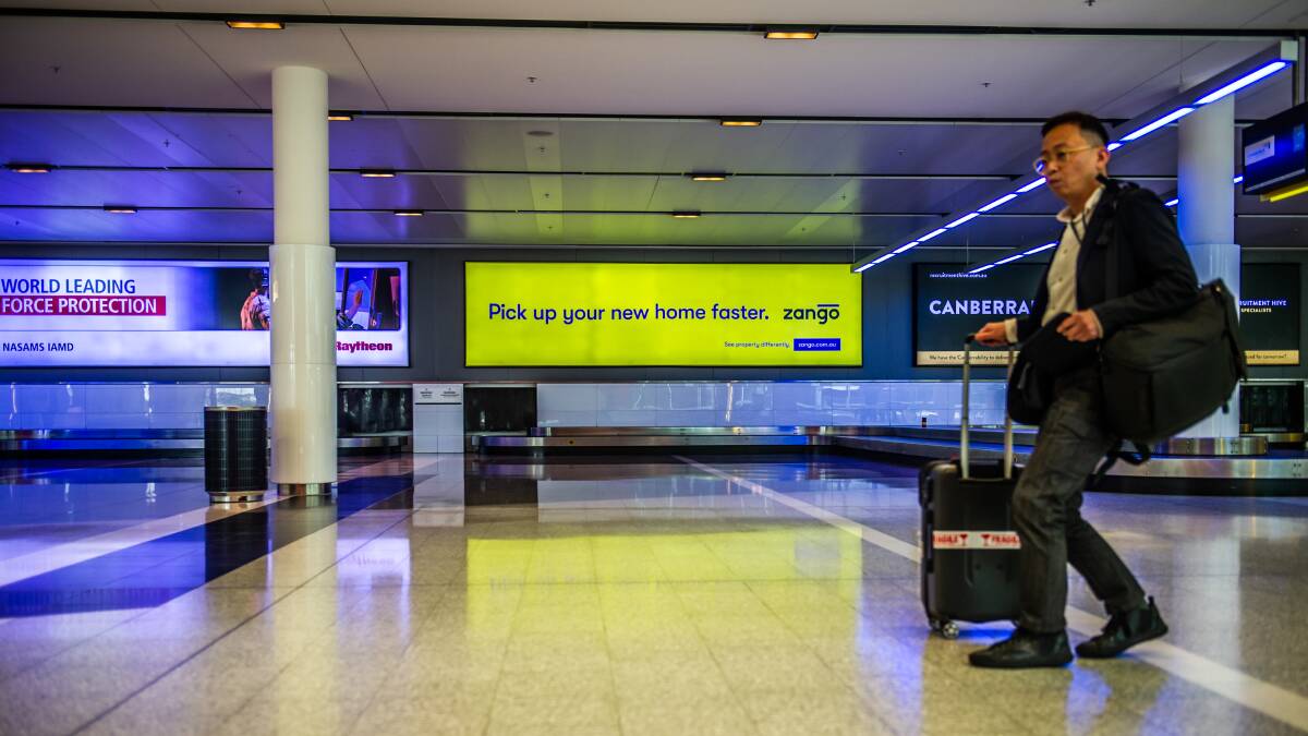 An ad for Zango is splashed above a baggage carousel at Canberra Airport. Picture: Karleen Minney.