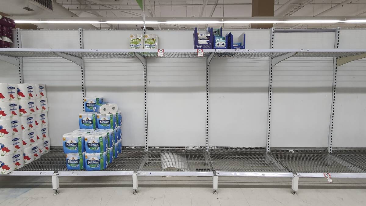 Stocks of toilet paper at a Coles supermarket in Manuka run low on Tuesday evening as people begin stockpiling groceries amidst fears of a coronavirus outbreak. Picture: Sitthixay Ditthavong