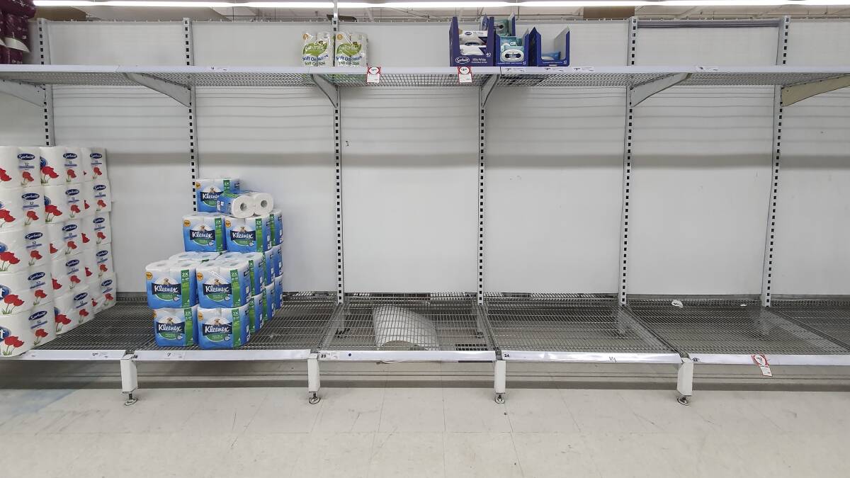 Stocks of toilet paper at a Coles supermarket in Manuka run low. Picture: Sitthixay Ditthavong.