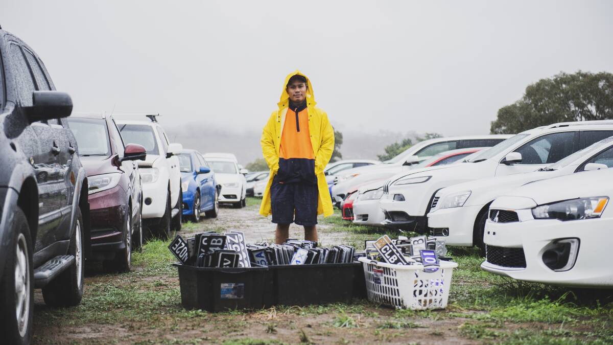 Salvage yard supervisor Pierre Vongphit with the hundreds of registration plates removed from cars at the Manheim car storage facility at Majura. Picture: Dion Georgopoulos