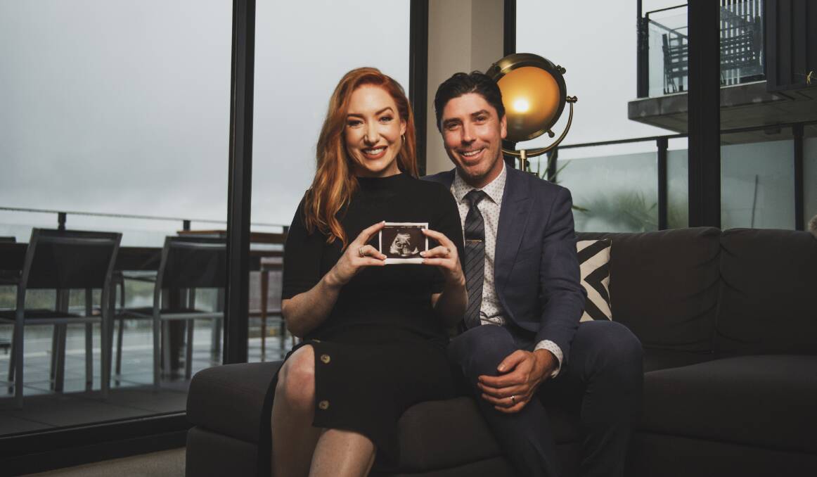  Kristen and Iain Davidson, at home in Kingson, with a scan of their baby due in August. Picture: Dion Georgopoulos 