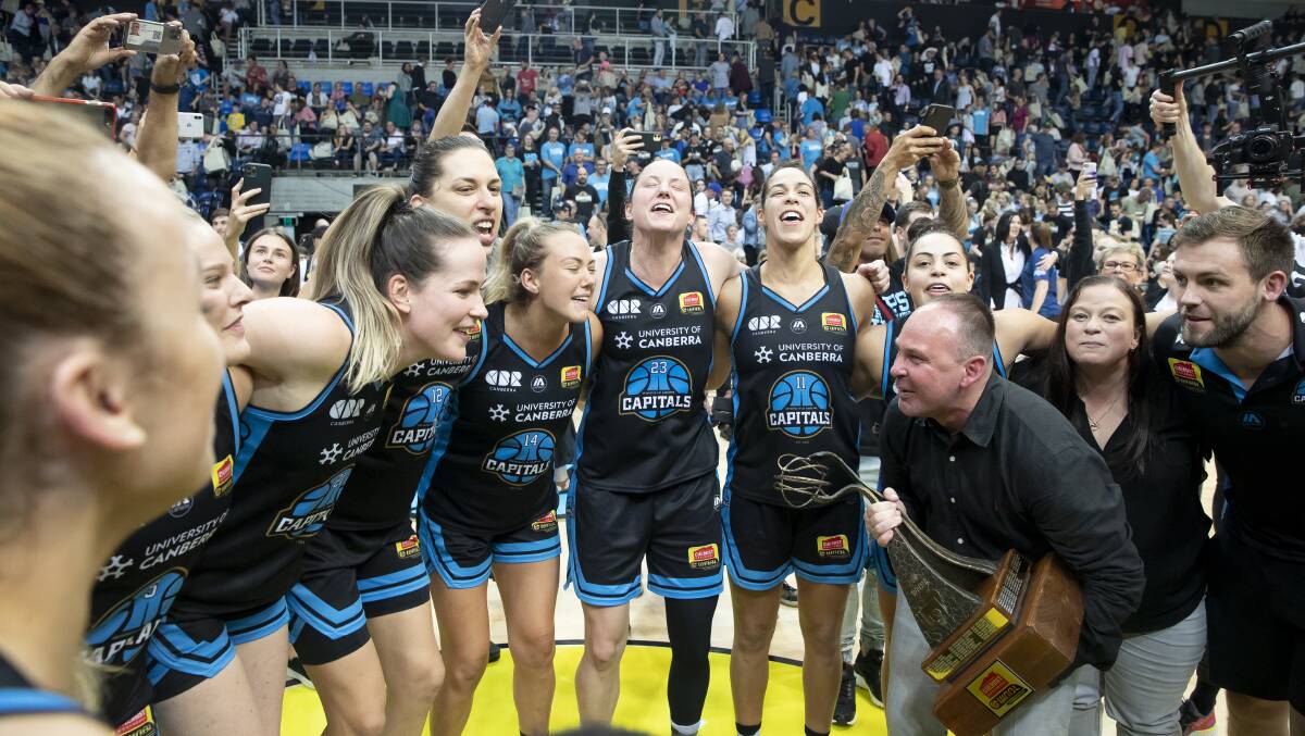 The Canberra Capitals celebrate winning consecutive WNBL championships. Picture: Sitthixay Ditthavong