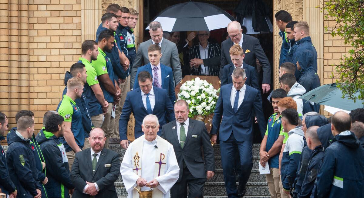The Raiders formed a guard of honour as Don Furner snr was led out of St Christopher's Cathedral by his sons David and Don jnr. Picture: Elesa Kurtz