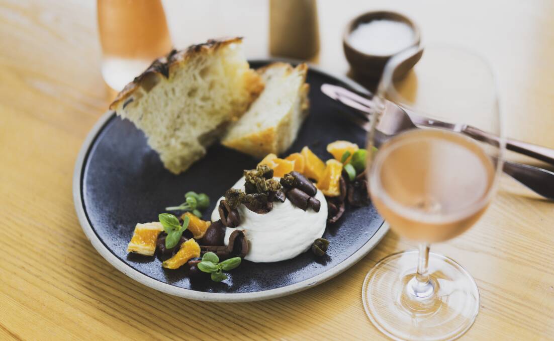 Focaccia al forno, house-made focaccia served with whipped ricotta, black olives, preserved orange, and fried capers. Picture: Dion Georgopoulos 