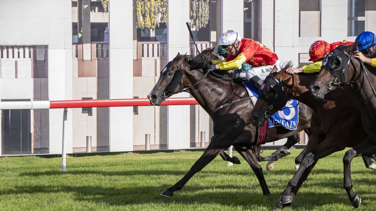 Barbaric (red silk, white cap) surges to take out the 2020 Black Opal Stakes. Picture: Sitthixay Ditthavong