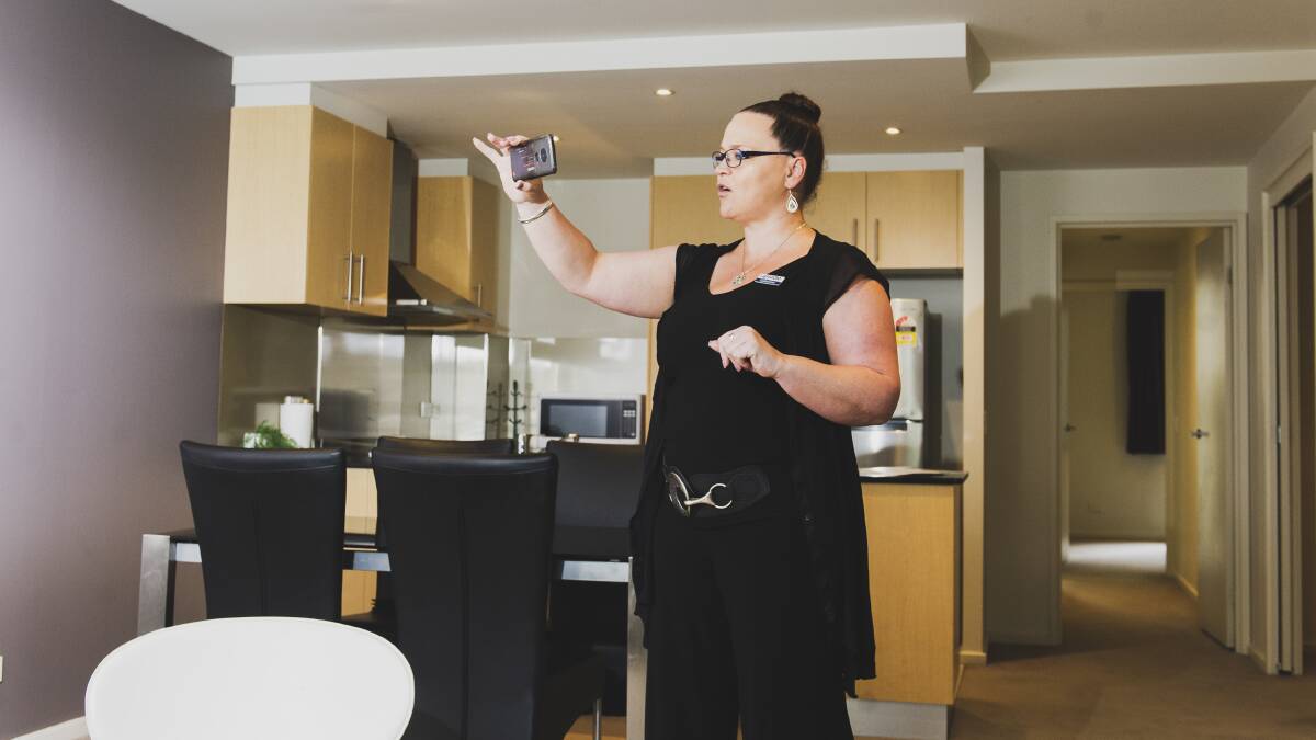 Catherine Halloran conducts a virtual inspection in a Canberra apartment. Picture: Dion Georgopoulos