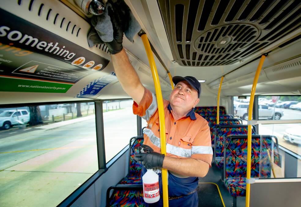 Transport Canberra bus cleaner Miles Kemp. His job is now crucial to keeping the virus at bay in Canberra. Picture: Elesa Kurtz