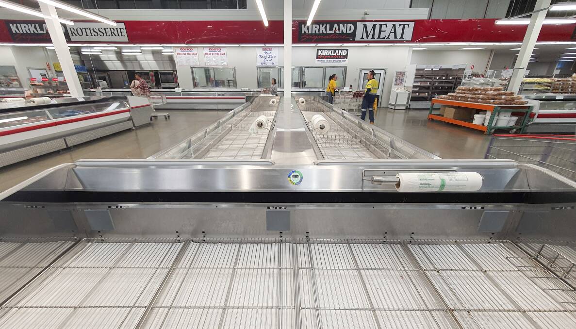 There were empty shelves in supermarkets across Canberra as shoppers rushed to stock up on supplies. Picture: Sitthixay Ditthavong