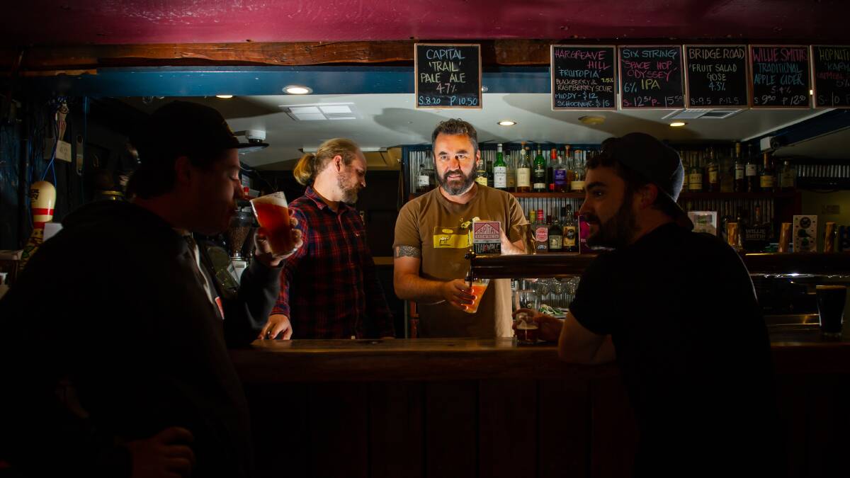 General manager Rich Cockram and owner Ben Johnston behind the bar, as the Old Canberra Inn serves up its last drinks before lockdown. Picture: Karleen Minney