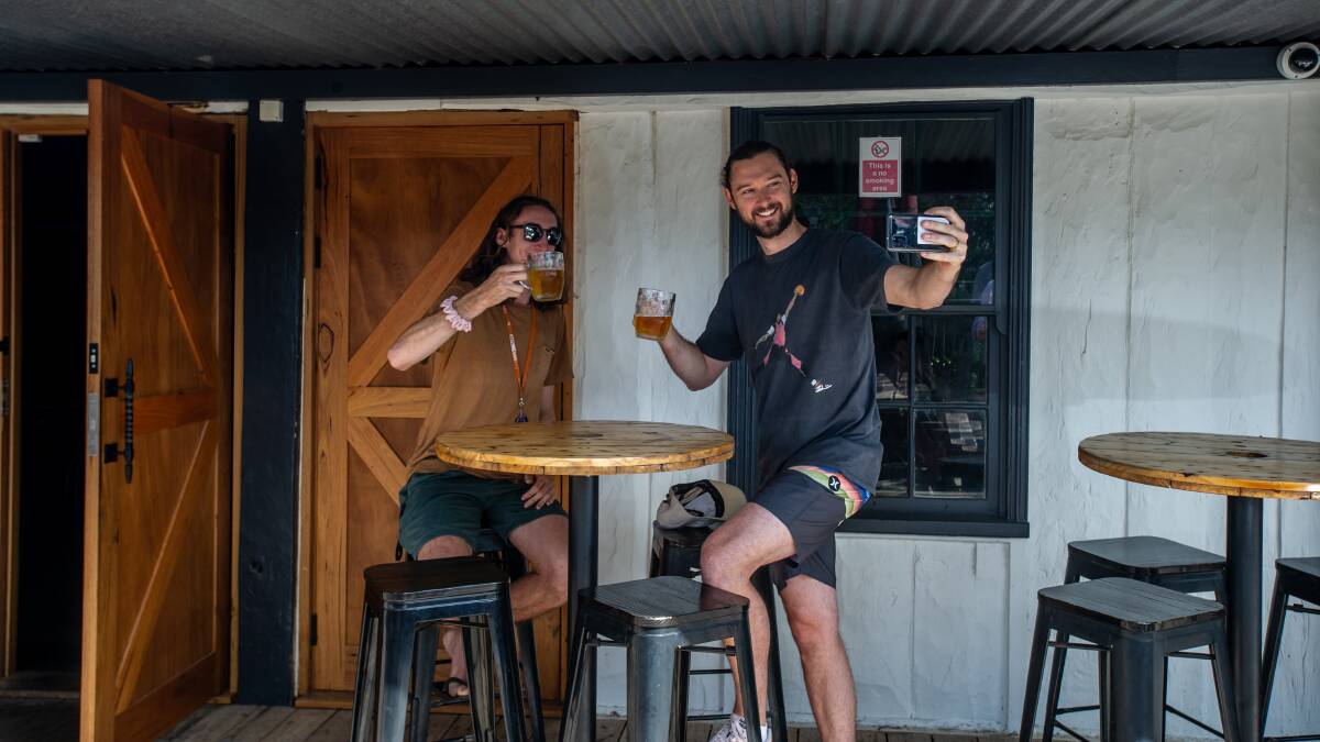 Patrons and brothers Ryan and Brendan Armstrong share their last beer at the pub for a while. Picture: Karleen Minney
