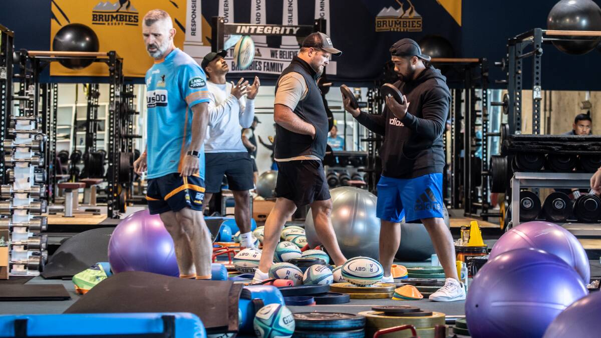 Brumbies players visit their headquarters gym for the last time before COVID-19 isolation suspends further matches, taking home gear to continue their training. Picture: Karleen Minney