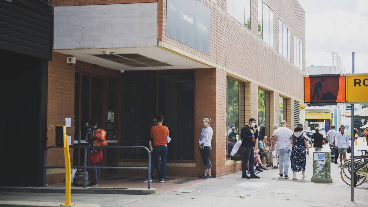 A long queue outside Centrelink in Braddon as thousands lost their job due to the coronavirus shutdown. Picture: Dion Georgopoulos