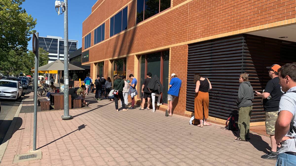 Long lines formed outside Centrelink offices after the hospitality industry was effectively shutdown on March 23