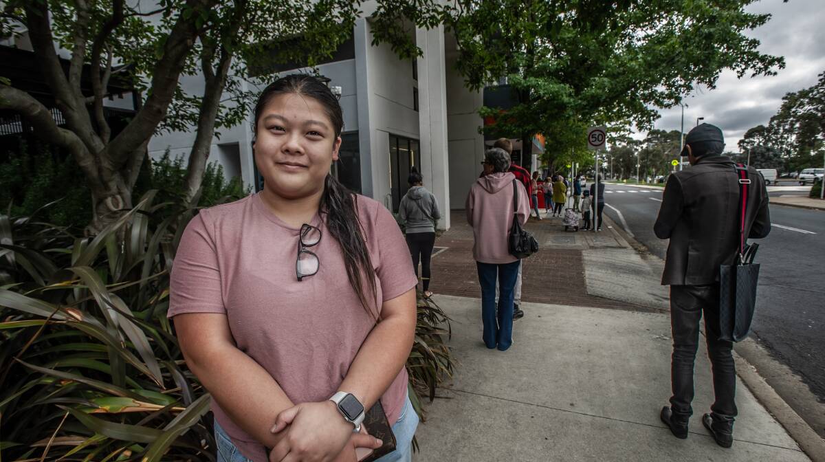 Cafe worker Minnie Chaiyabarn in the line to access Centrelink. Picture: Karleen Minney