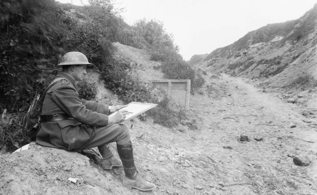War artist Will Dyson at work, May 1918. Pictures: Australian War Memorial