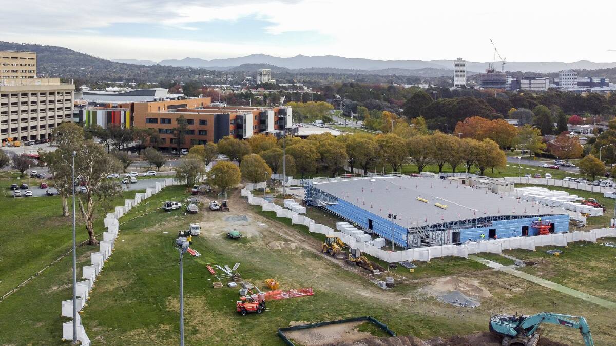 Temporary COVID-19 emergency department under construction at Garran Oval.