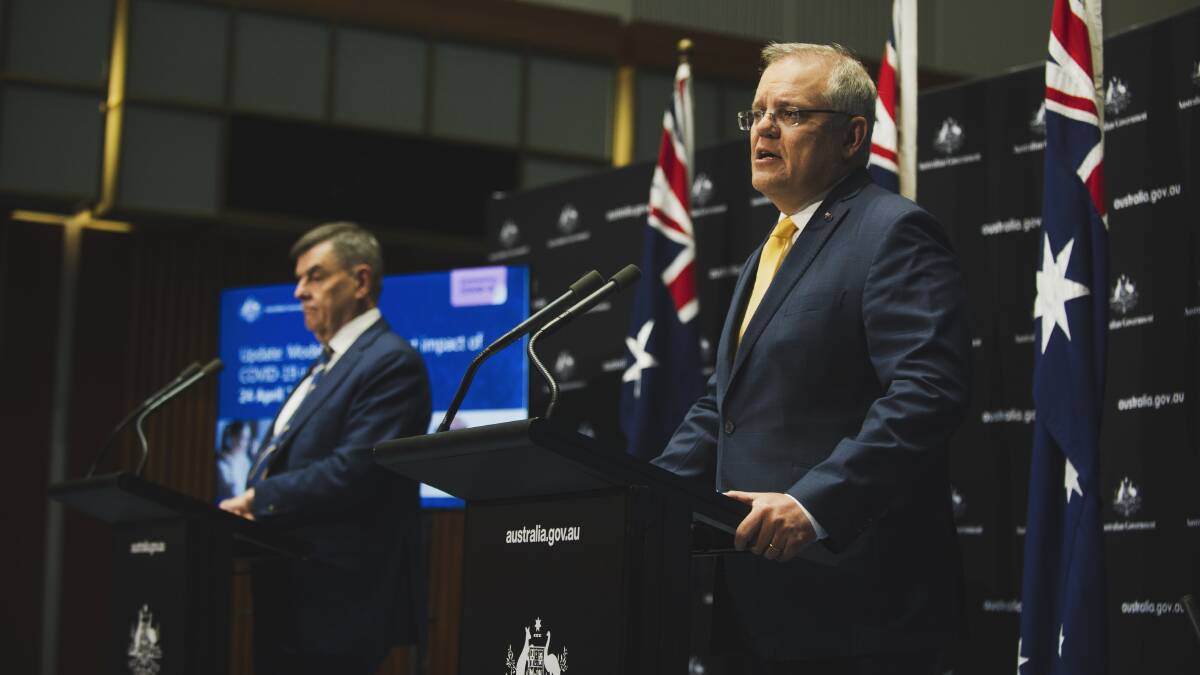Prime Minister Scott Morrison and Chief Medical Officer Brendan Murphy present an update on modelling of the current impact of COVID-19 on Thursday. Picture: Dion Georgopoulos