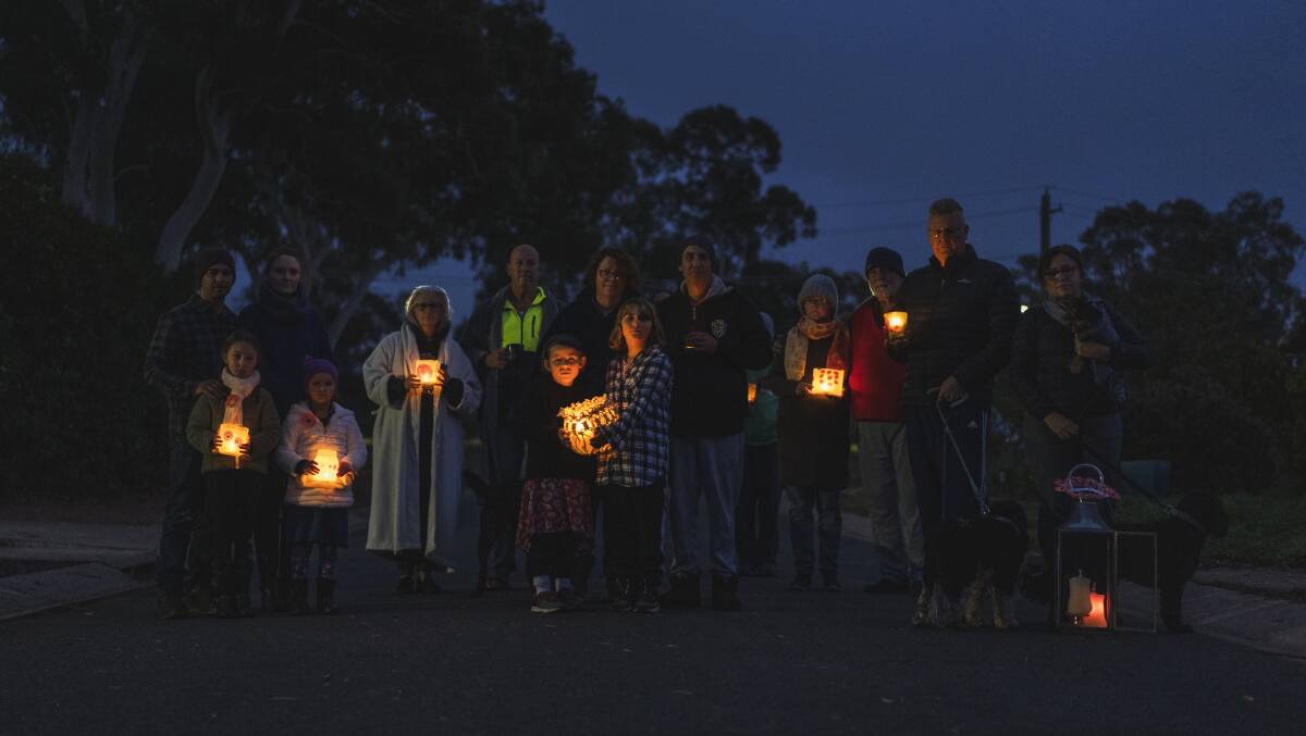 The residents of a Kambah cul-de-sac who came together at dawn on Saturday to commemorate Anzac Day. Picture: Dion Georgopoulos