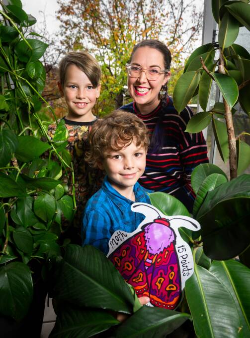 Artist Sophie Kristine created the Iso Spy Challenge to keep her kids entertained by sticking coloured bugs around the suburb to be found by kids in the area. She is pictured with her sons Oskar Boyson, 8, and Felix Boyson, 6. Picture: Elesa Kurtz