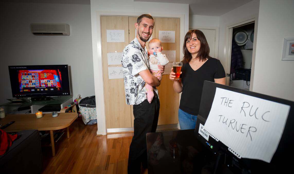 Liam Kirwan and Bella Counihan, with seven-month-old daughter Ruby. Liam and Bella are patrons of the "Remote RUC", the coronavirus version of the popular Turner club. Picture: Elesa Kurtz