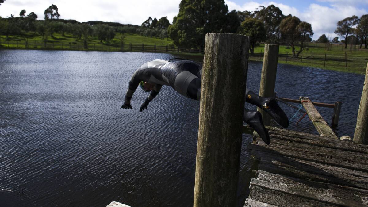Slater dives into the dam that's about 13 degrees. Picture: Dion Georgopoulos