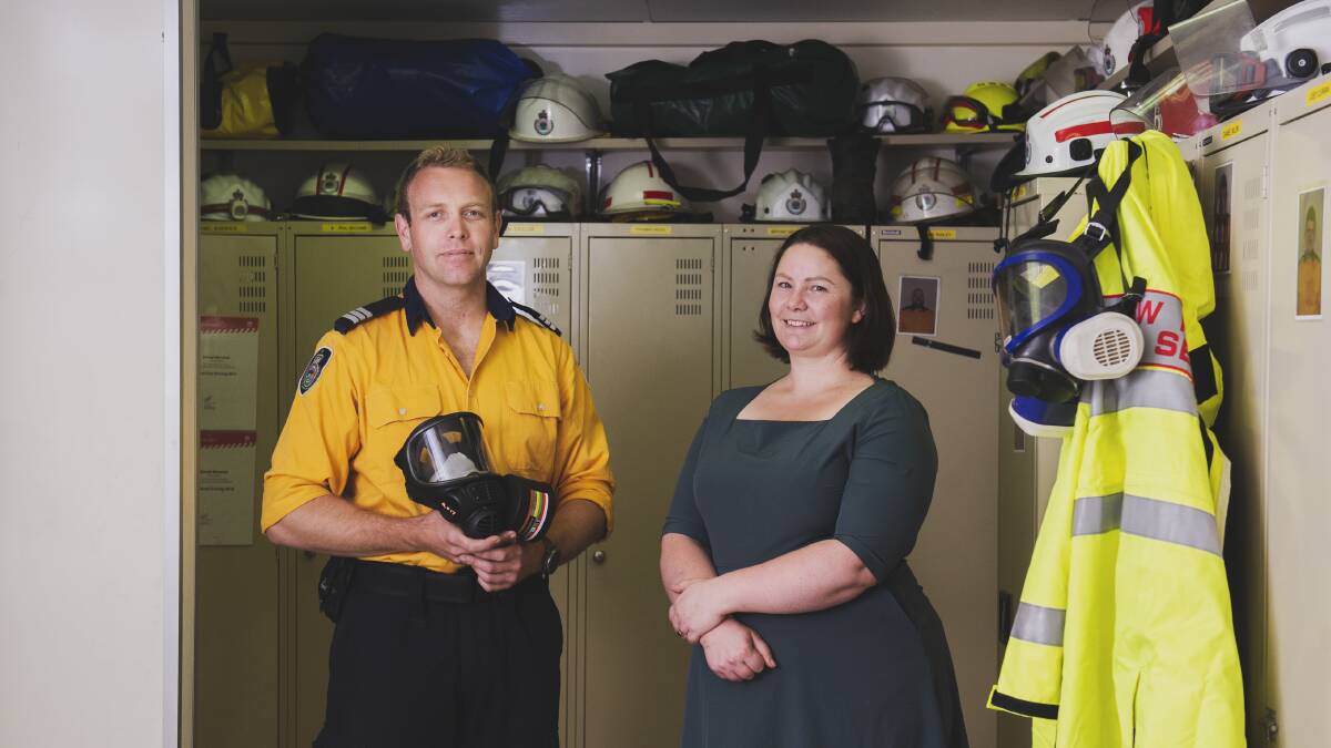 Queanbeyan RFS captain Nick Hornbuckle with Amelia Maria at the Queanbeyan RFS shed where she has donated new masks. Picture: Dion Georgopoulos