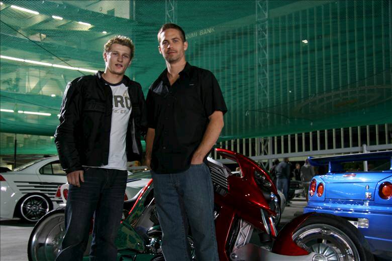 Mr Kember with deceased Fast and Furious star Paul Walker. Picture: StarNow