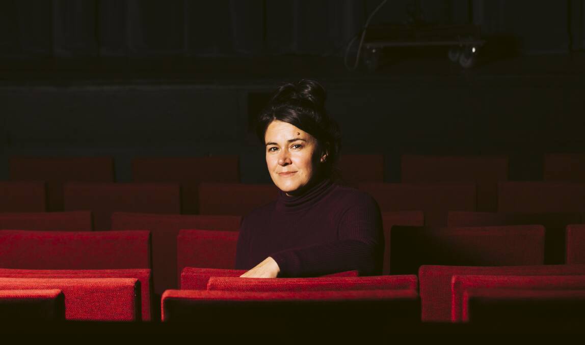 A New Approach program director Kate Fielding among the empty seats of the Canberra Theatre on Wednesday. Picture: Jamila Toderas
