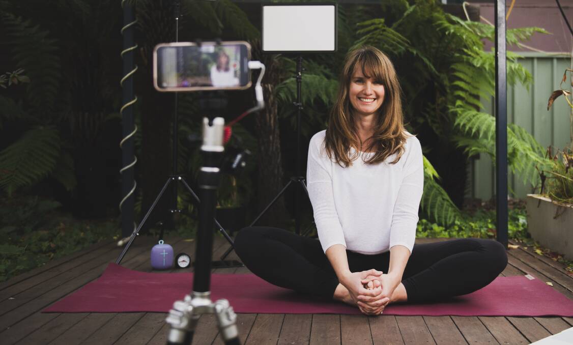 The founder of Flow Yoga Canberra, Odona Farska, at her home in Lyneham, where she has created a makeshift yoga studio to livestream her classes. Picture: Dion Georgopoulos