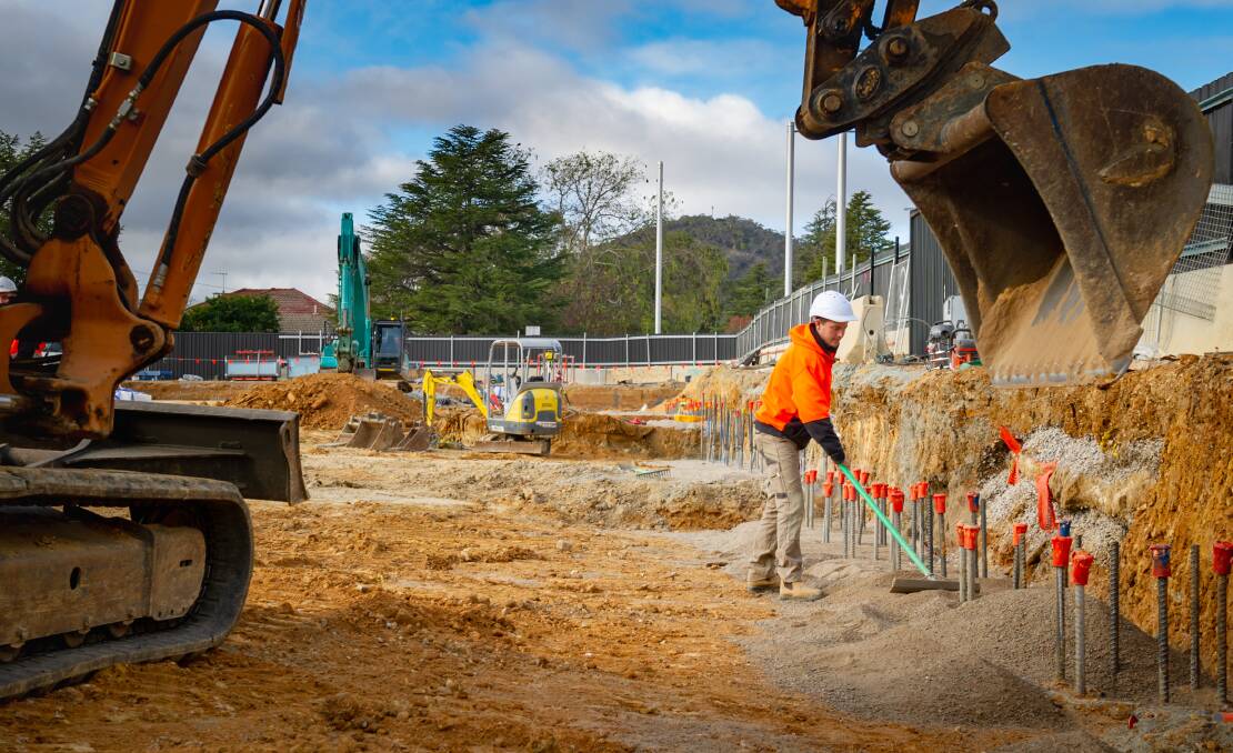 Apprentice Brendon Arneill works on the site of JWLand's Founders Lane development in Braddon, which has been fast-tracked. Picture: Elesa Kurtz