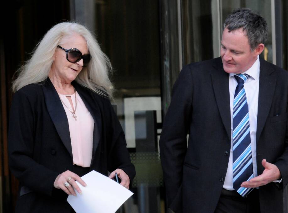 Sharon Ann Stott leaves the ACT Supreme Court during her trial with her barrister, Steven Whybrow. Picture: Blake Foden