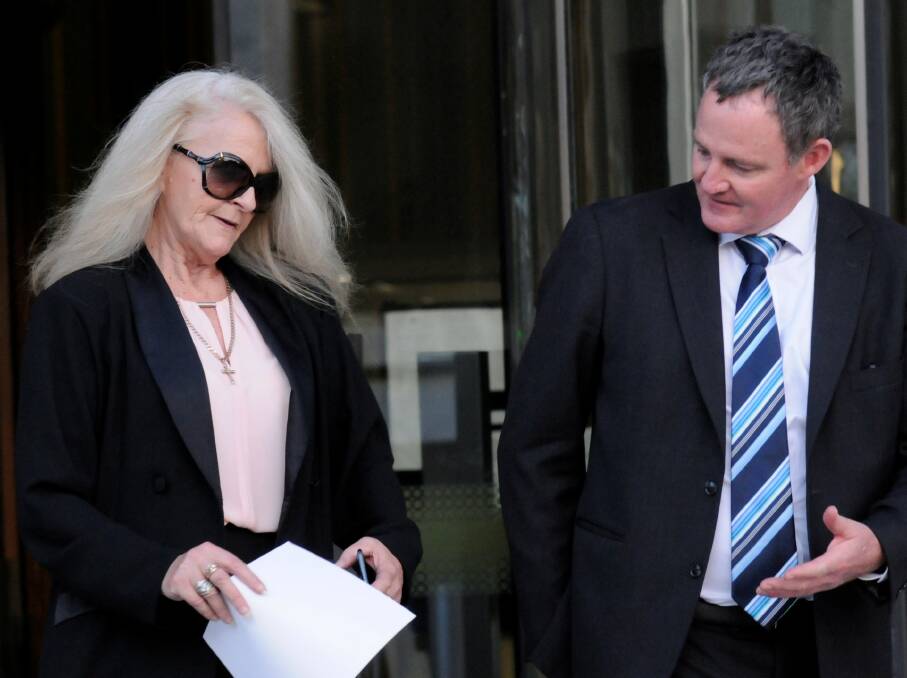 Sharon Ann Stott leaves the ACT Supreme Court on Tuesday with her barrister, Steven Whybrow. Picture: Blake Foden