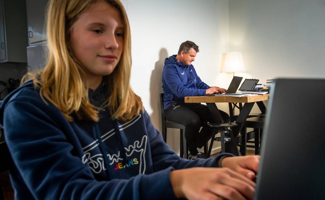 Dr John Williams, UC assistant professor in physical education has found some innovative ways to teach from home. Pictured with daughter Charlotte, 11. Picture: Elesa Kurtz